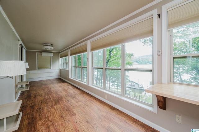840 Black Acres Rd, Cropwell, AL 35054 - unfurnished sunroom featuring plenty of natural light, a wall mounted AC, wood finished floors, and ornamental molding