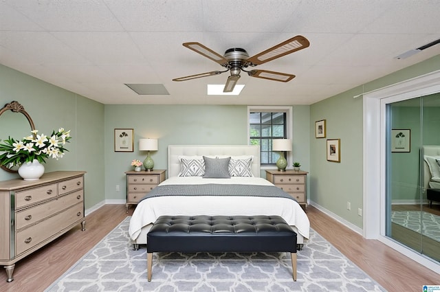 840 Black Acres Rd, Cropwell, AL 35054 - bedroom featuring wood finished floors, ceiling fan, ensuite bath, and a drop ceiling