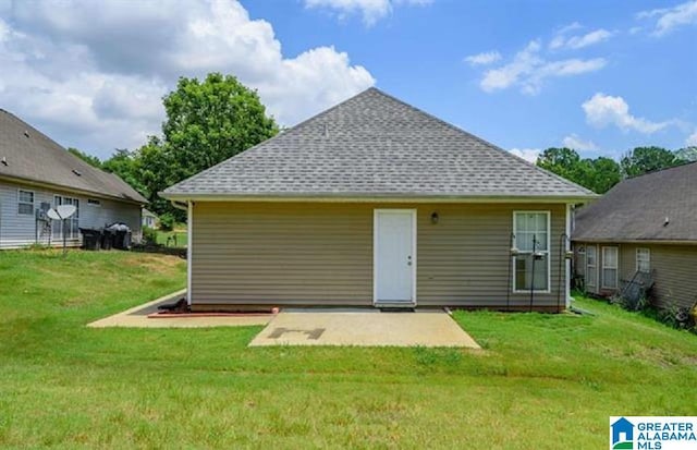 423 Camden Cove Cir, Calera, AL 35040 - rear view of property with a patio, a lawn, and roof with shingles
