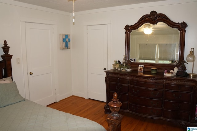 702 4th St SW, Childersburg, AL 35044 - bedroom featuring wood finished floors and baseboards