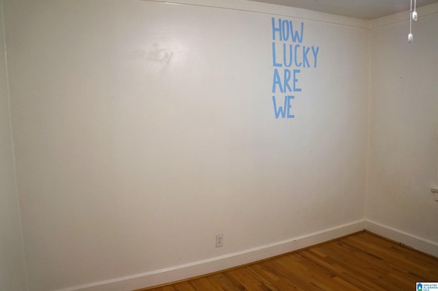 702 4th St SW, Childersburg, AL 35044 - empty room with light wood finished floors and baseboards