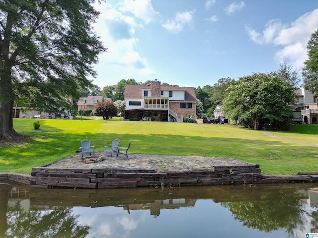 7835 Windsong Dr, Trussville, AL 35173 - dock area with a fire pit, stairs, a yard, and a deck with water view