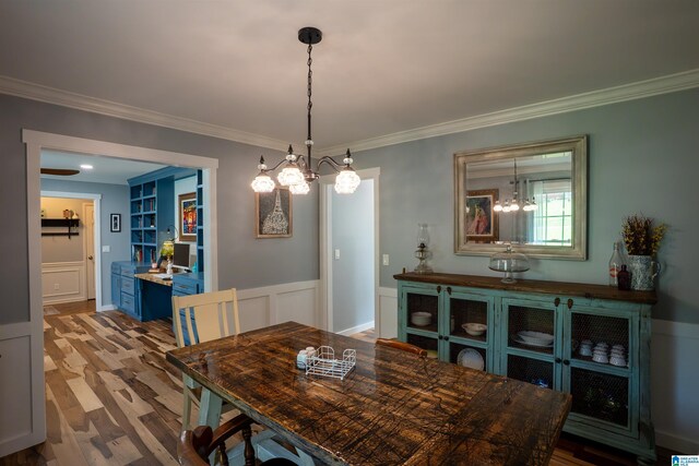 7835 Windsong Dr, Trussville, AL 35173 - dining area with a chandelier, ornamental molding, and wood finished floors
