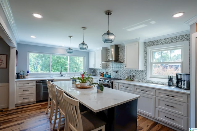 7835 Windsong Dr, Trussville, AL 35173 - kitchen featuring wall chimney range hood, dishwasher, crown molding, gas stove, and white cabinets