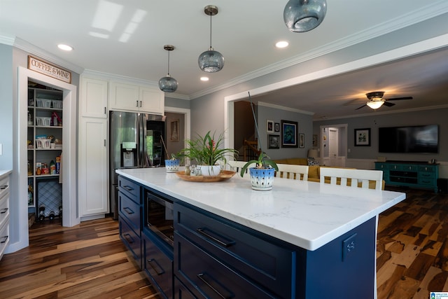 7835 Windsong Dr, Trussville, AL 35173 - kitchen featuring blue cabinets, white cabinets, dark wood-style flooring, stainless steel appliances, and open floor plan