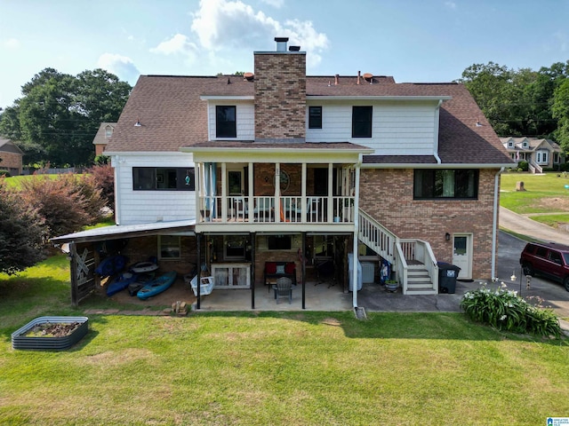 7835 Windsong Dr, Trussville, AL 35173 - rear view of house with a patio area, a chimney, a yard, and a sunroom