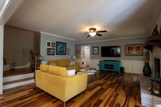 7835 Windsong Dr, Trussville, AL 35173 - living room with wood finished floors, ceiling fan, wainscoting, and crown molding