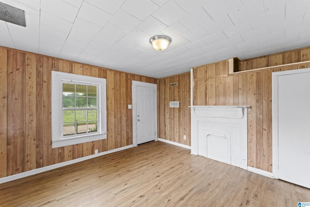 606 W Pine St, Sylacauga, AL 35150 - entrance foyer with wood finished floors and wood walls