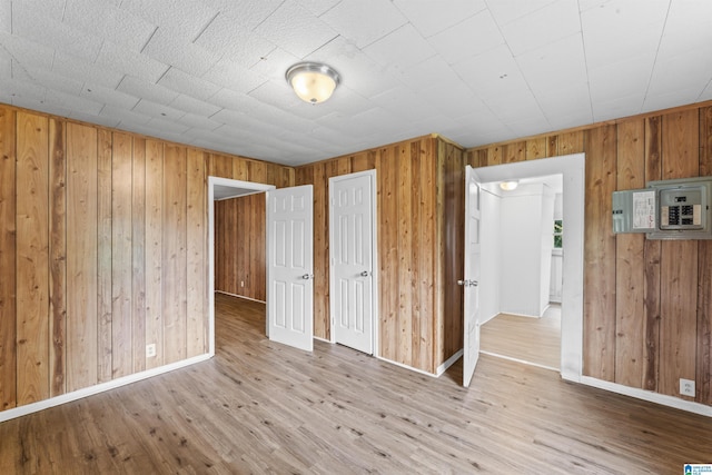 606 W Pine St, Sylacauga, AL 35150 - unfurnished bedroom with wood walls and wood finished floors