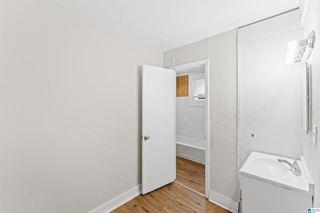 606 W Pine St, Sylacauga, AL 35150 - bathroom featuring vanity and wood finished floors