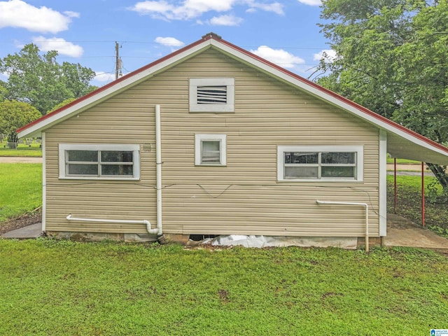606 W Pine St, Sylacauga, AL 35150 - view of property exterior with a lawn