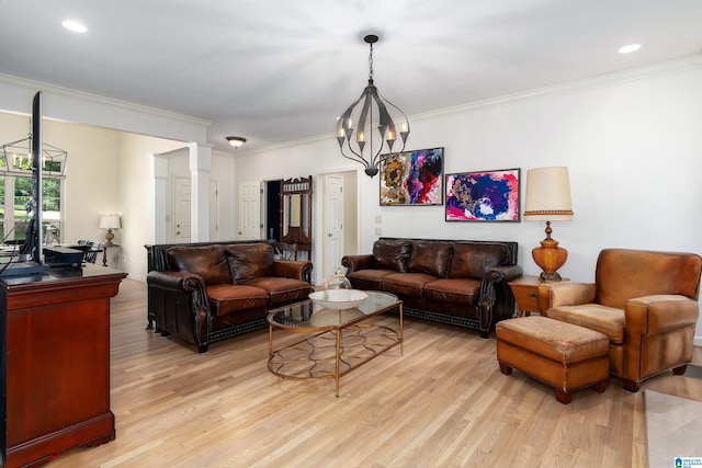 3130 Cahaba Park Dr, Trussville, AL 35173 - living room featuring light wood-style floors, crown molding, a chandelier, and decorative columns