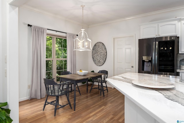 3130 Cahaba Park Dr, Trussville, AL 35173 - dining area with light wood-style flooring and ornamental molding