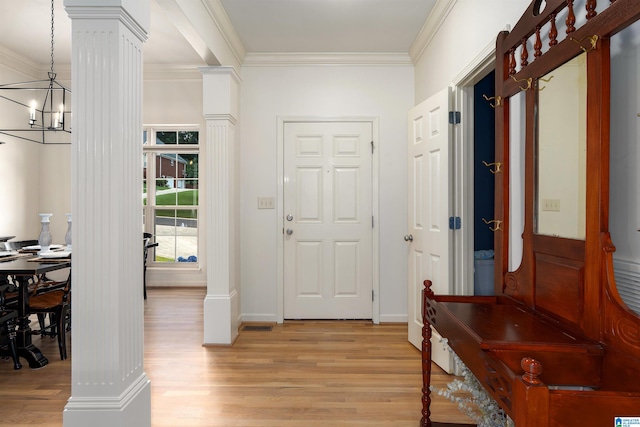3130 Cahaba Park Dr, Trussville, AL 35173 - foyer featuring ornate columns, light wood finished floors, a chandelier, and crown molding