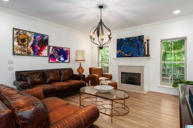 3130 Cahaba Park Dr, Trussville, AL 35173 - living room featuring light wood-type flooring, crown molding, healthy amount of natural light, a high end fireplace, and recessed lighting