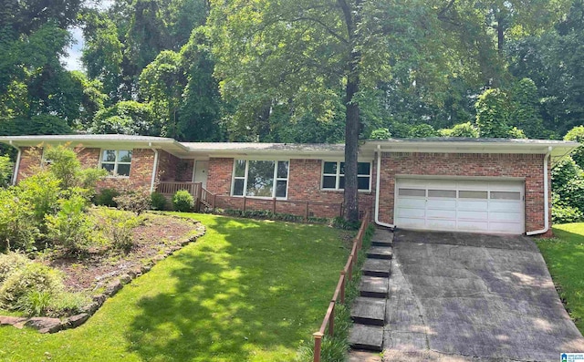 741 Lance Blvd, Birmingham, AL 35206 - ranch-style home featuring asphalt driveway, a front lawn, and brick siding