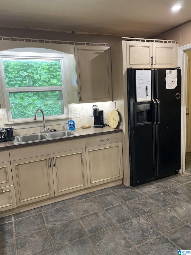 741 Lance Blvd, Birmingham, AL 35206 - kitchen with black refrigerator with ice dispenser and tasteful backsplash