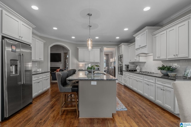 2000 Regency Way, Birmingham, AL 35242 - kitchen featuring appliances with stainless steel finishes, ornamental molding, arched walkways, backsplash, and recessed lighting