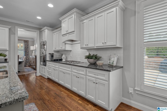 2000 Regency Way, Birmingham, AL 35242 - kitchen featuring dark wood-type flooring, white cabinetry, tasteful backsplash, stainless steel appliances, and recessed lighting