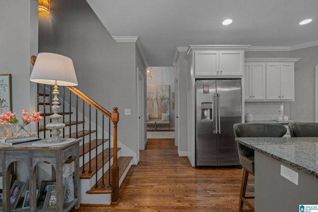 2000 Regency Way, Birmingham, AL 35242 - kitchen featuring stainless steel refrigerator with ice dispenser, crown molding, dark wood-style floors, white cabinets, and light stone counters