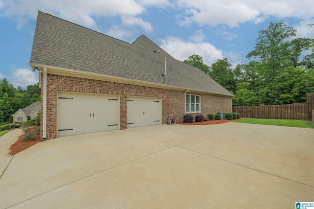 2000 Regency Way, Birmingham, AL 35242 - view of side of property with driveway, a shingled roof, and brick siding