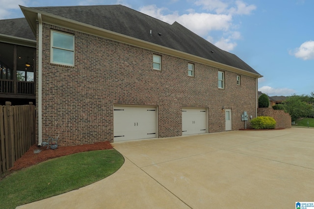2000 Regency Way, Birmingham, AL 35242 - view of property exterior featuring brick siding, concrete driveway, an attached garage, and roof with shingles