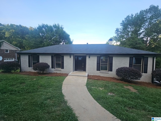3317 Teakwood Rd, Hoover, AL 35226 - single story home with brick siding, a front lawn, a chimney, and a shingled roof