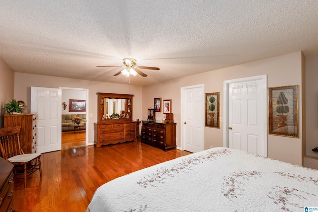 20571 Faynell Cir, Woodstock, AL 35188 - bedroom featuring wood finished floors, a textured ceiling, and ceiling fan