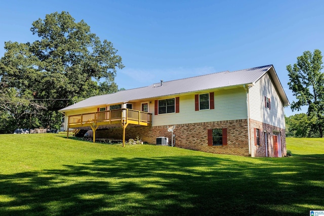20571 Faynell Cir, Woodstock, AL 35188 - back of property featuring a lawn, a wooden deck, a metal roof, and brick siding