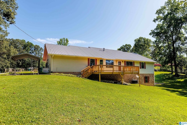 20571 Faynell Cir, Woodstock, AL 35188 - rear view of house with a wooden deck, a yard, a metal roof, a carport, and stairs