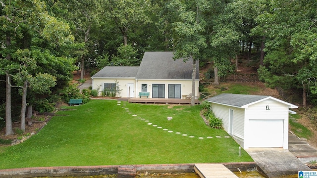 442 Lakeview Cir, Alpine, AL 35014 - view of front facade featuring an outdoor structure, a front yard, a deck, a garage, and roof with shingles