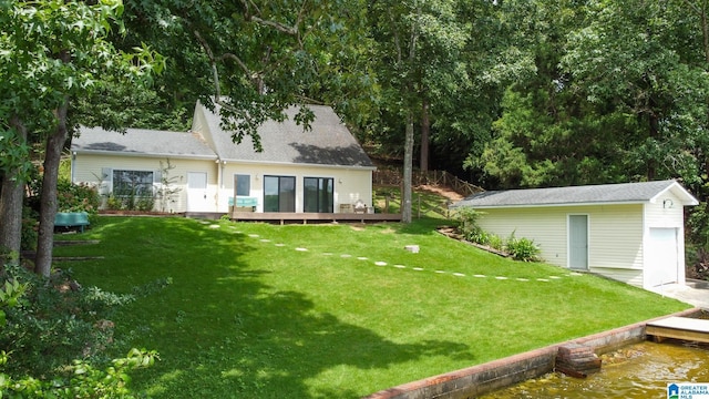 442 Lakeview Cir, Alpine, AL 35014 - rear view of house featuring an outdoor structure, a lawn, and a deck with water view