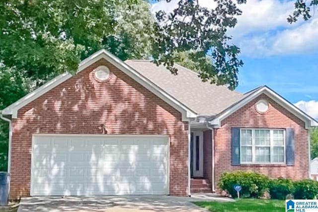 489 Bailey Loop Rd, Gardendale, AL 35071 - view of front of home with concrete driveway, an attached garage, and brick siding