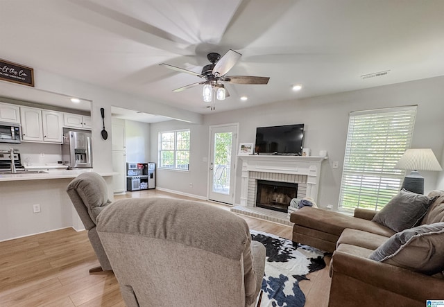 489 Bailey Loop Rd, Gardendale, AL 35071 - living room with light wood-style floors, ceiling fan, a fireplace, and recessed lighting