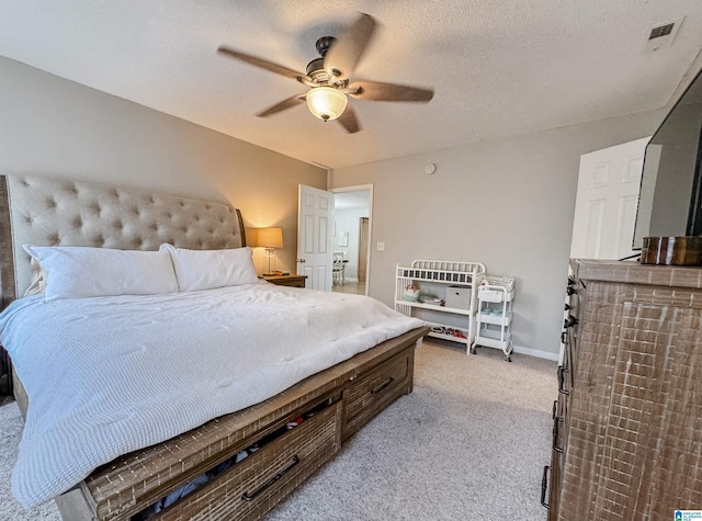 489 Bailey Loop Rd, Gardendale, AL 35071 - bedroom with light colored carpet, ceiling fan, and a textured ceiling
