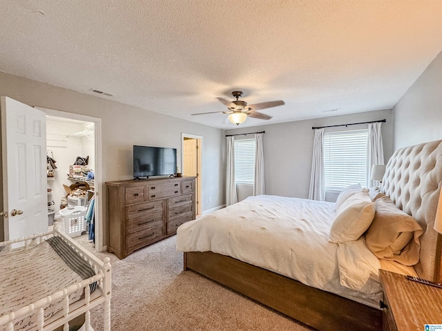 489 Bailey Loop Rd, Gardendale, AL 35071 - bedroom with light carpet, a ceiling fan, and a textured ceiling