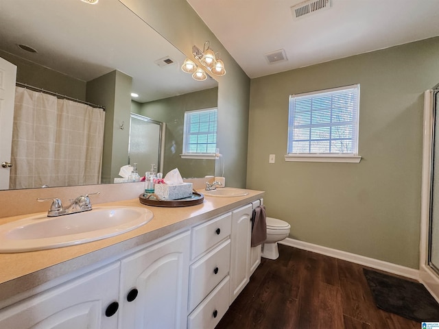 489 Bailey Loop Rd, Gardendale, AL 35071 - full bathroom with wood finished floors, double vanity, and a shower with shower curtain