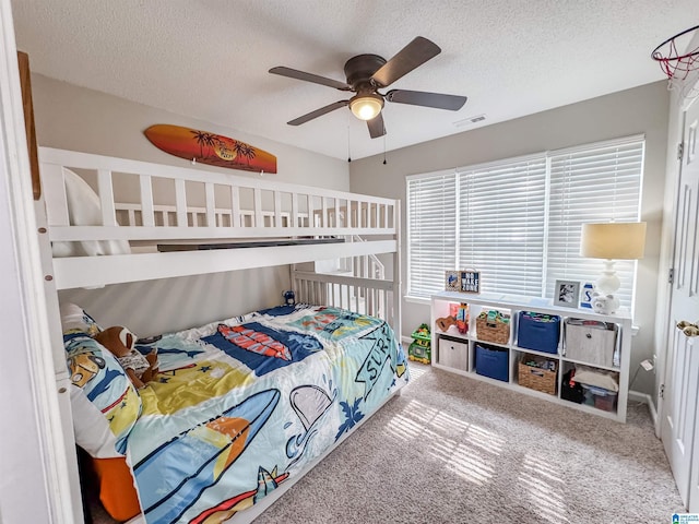 489 Bailey Loop Rd, Gardendale, AL 35071 - carpeted bedroom with a textured ceiling and a ceiling fan