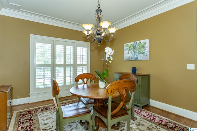 5668 Carrington Lake Pkwy, Trussville, AL 35173 - dining area featuring ornamental molding, a chandelier, and light wood-type flooring