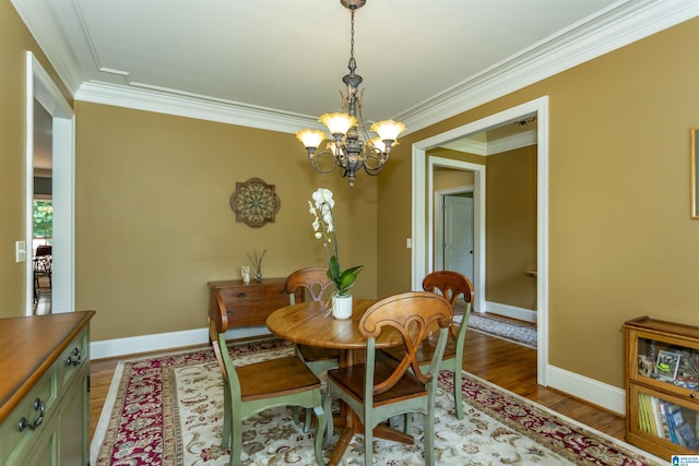 5668 Carrington Lake Pkwy, Trussville, AL 35173 - dining room featuring a chandelier, ornamental molding, and wood finished floors
