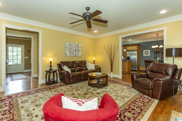 5668 Carrington Lake Pkwy, Trussville, AL 35173 - living area with ornamental molding, ceiling fan, wood finished floors, a chandelier, and recessed lighting