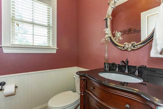 5668 Carrington Lake Pkwy, Trussville, AL 35173 - bathroom with vanity, a wainscoted wall, and a textured wall