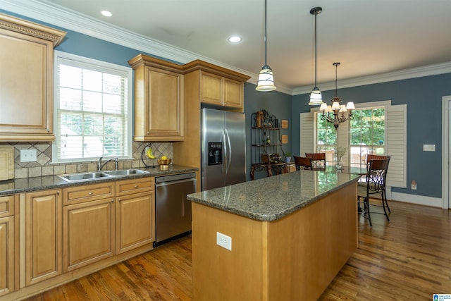 5668 Carrington Lake Pkwy, Trussville, AL 35173 - kitchen with appliances with stainless steel finishes, dark wood finished floors, a chandelier, backsplash, and ornamental molding