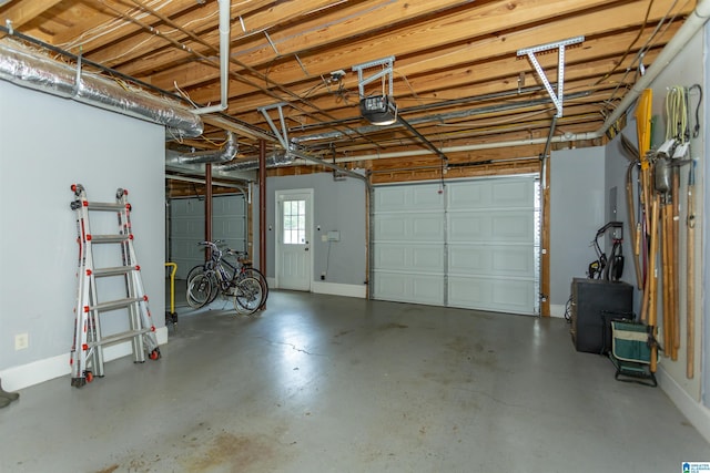 5668 Carrington Lake Pkwy, Trussville, AL 35173 - garage with a garage door opener and baseboards
