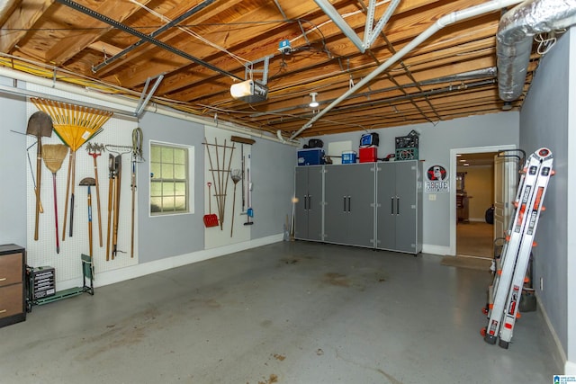 5668 Carrington Lake Pkwy, Trussville, AL 35173 - garage with a garage door opener and baseboards