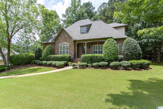 5668 Carrington Lake Pkwy, Trussville, AL 35173 - view of front of home featuring a front lawn, stone siding, brick siding, and a shingled roof