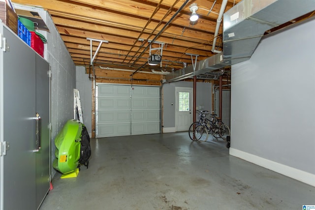 5668 Carrington Lake Pkwy, Trussville, AL 35173 - garage featuring a garage door opener and baseboards