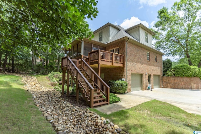 5668 Carrington Lake Pkwy, Trussville, AL 35173 - view of front of home with a sunroom, brick siding, an attached garage, stairway, and concrete driveway