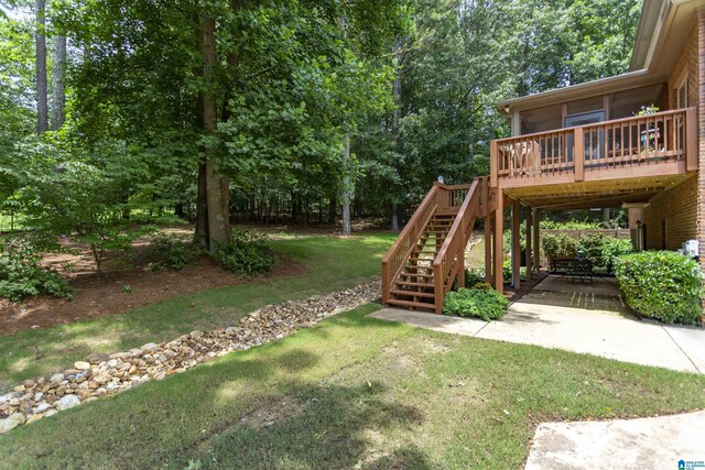5668 Carrington Lake Pkwy, Trussville, AL 35173 - view of green lawn featuring a wooden deck, stairway, and a patio