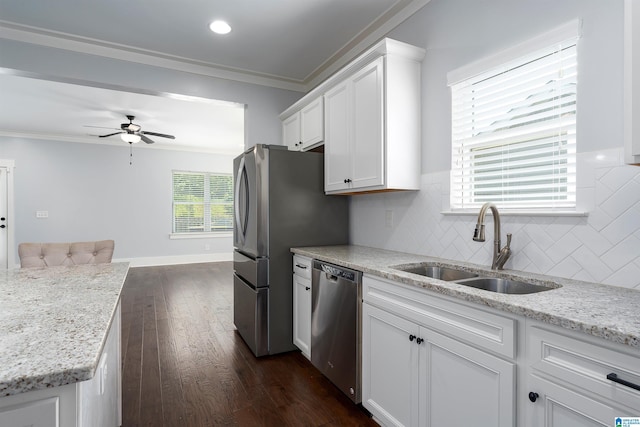 7593 Paine Dr, Trussville, AL 35173 - kitchen featuring stainless steel appliances, crown molding, a ceiling fan, white cabinetry, and dark wood finished floors